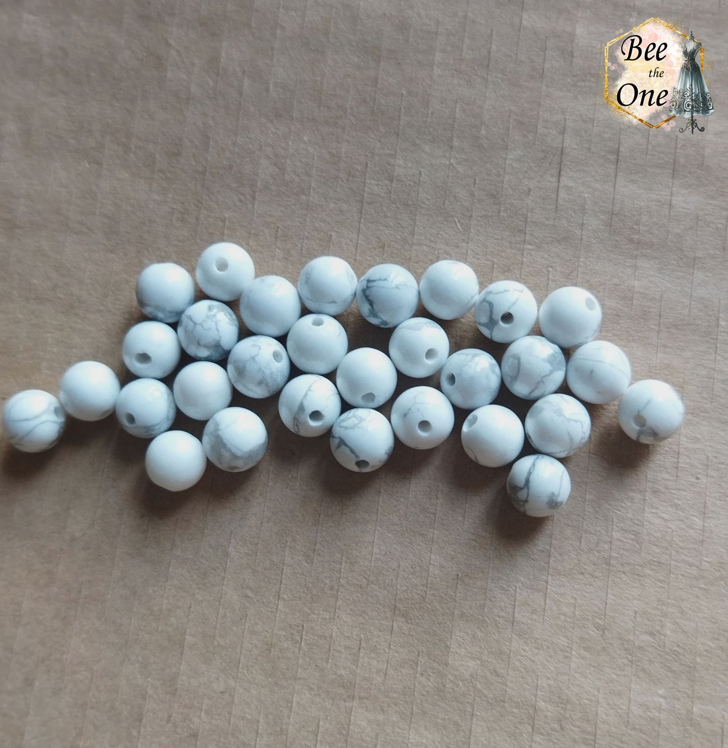 Perle ronde en howlite blanche naturelle - grade A - 6 mm