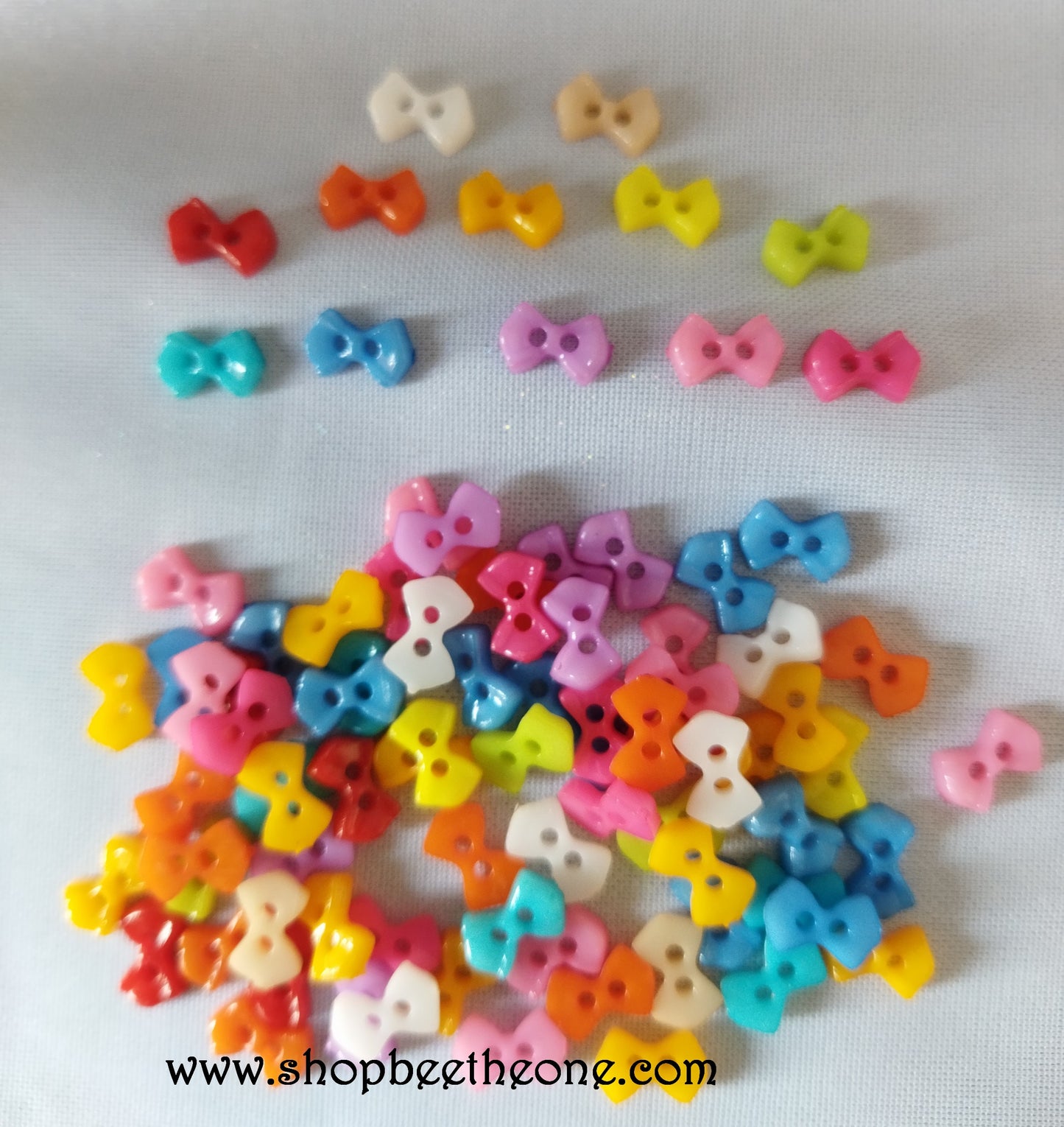 Mini Bouton Noeud en plastique - 9 mm - 12 coloris disponibles