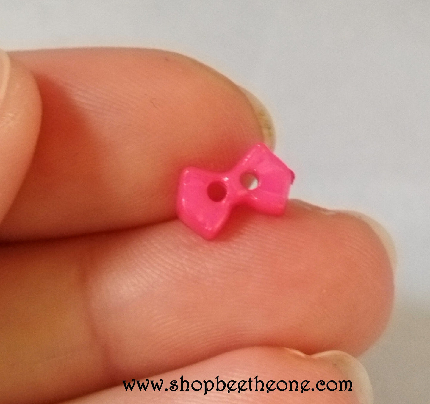 Mini Bouton Noeud en plastique - 9 mm - 12 coloris disponibles