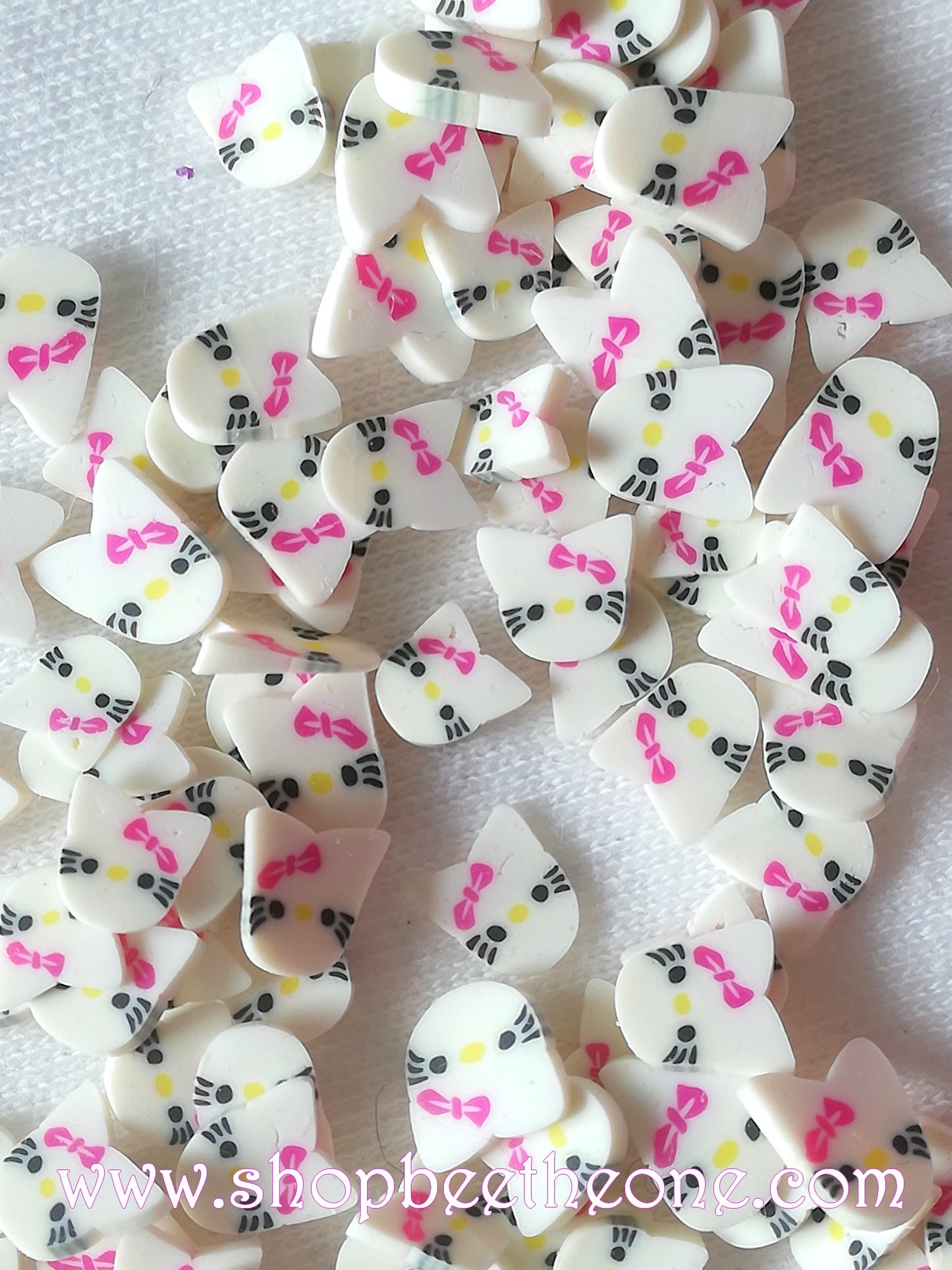 1 g (+/- 50 pièces) de Tranches de Fimo Pâte Polymère Kitty - noeud rose fuchsia ou bleu