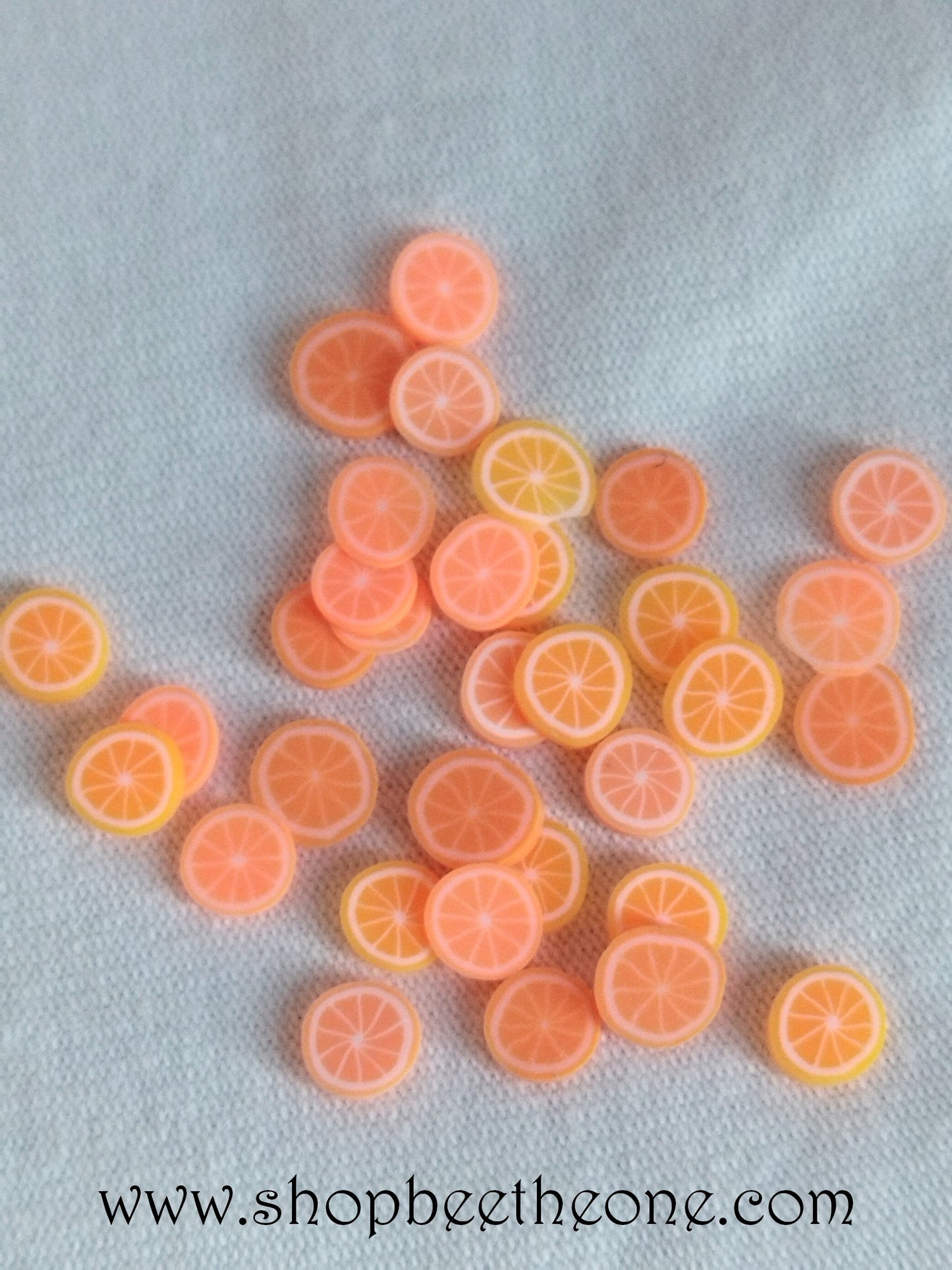 1 g (+/- 70 pièces) de Tranches de Fimo Pâte Polymère - Orange - 2 couleurs