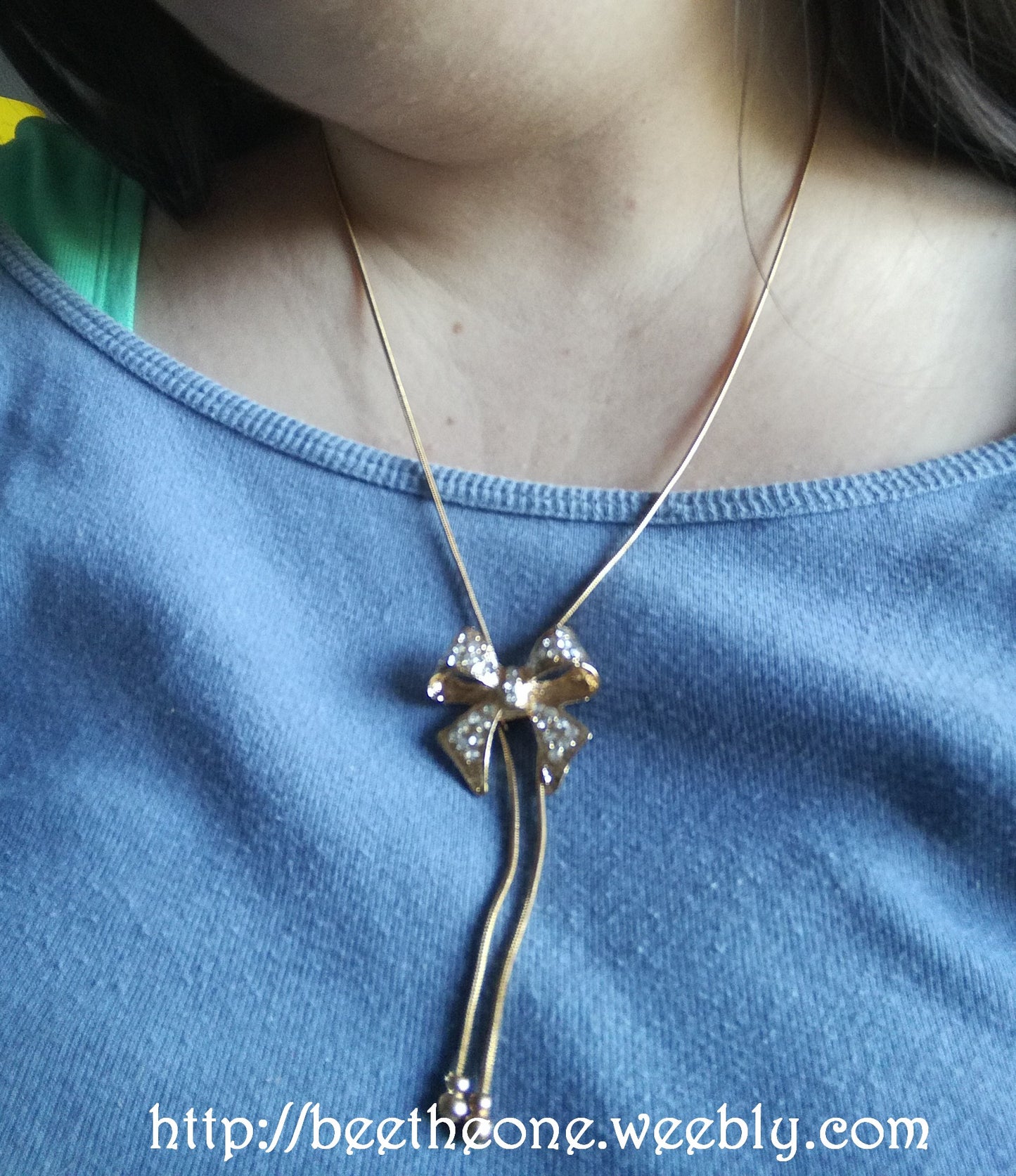 Collier pendentif Noeud et strass - Doré