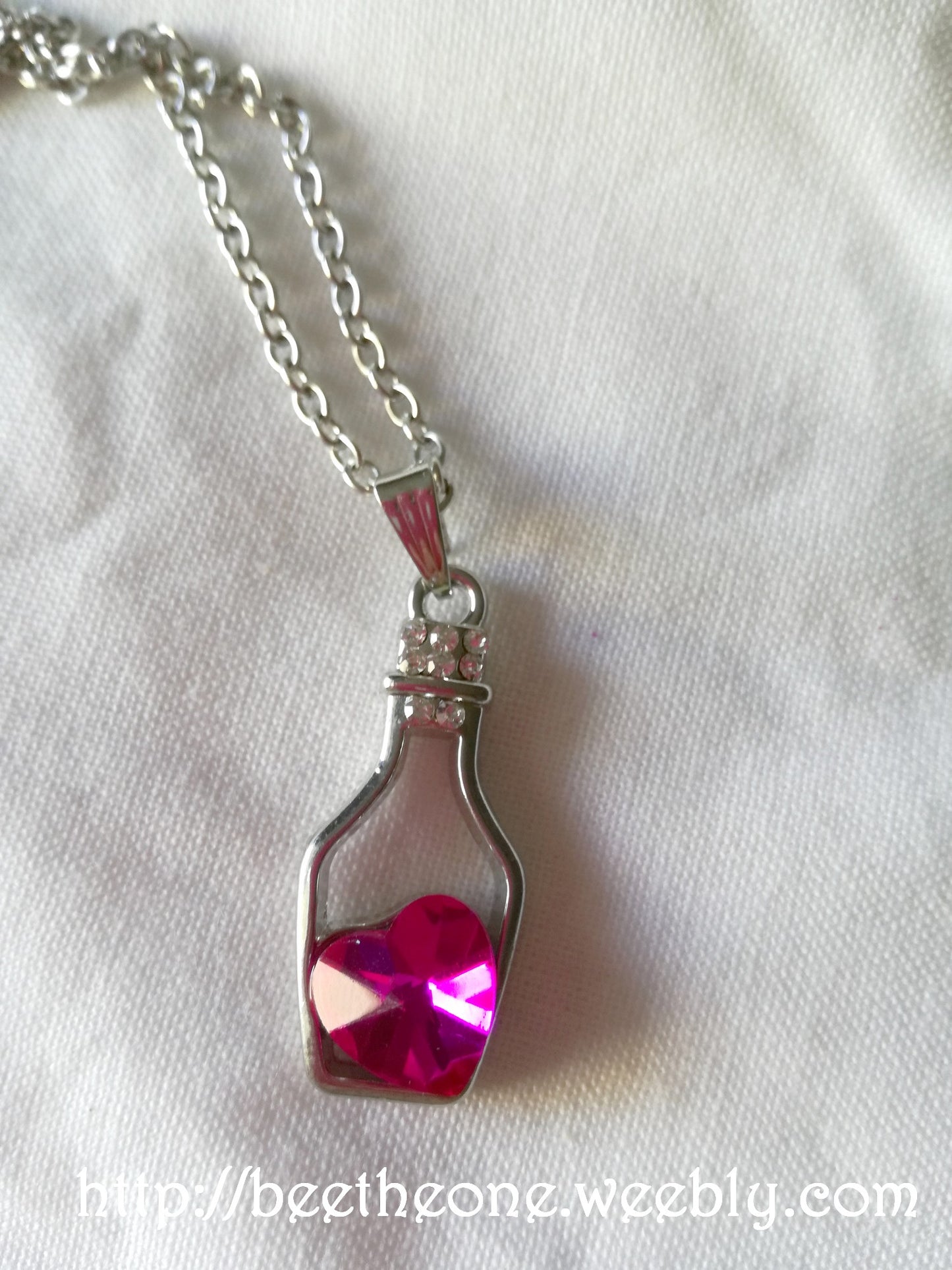 Collier pendentif Bouteille et coeur en cristal avec strass - Bleu ciel ou rose