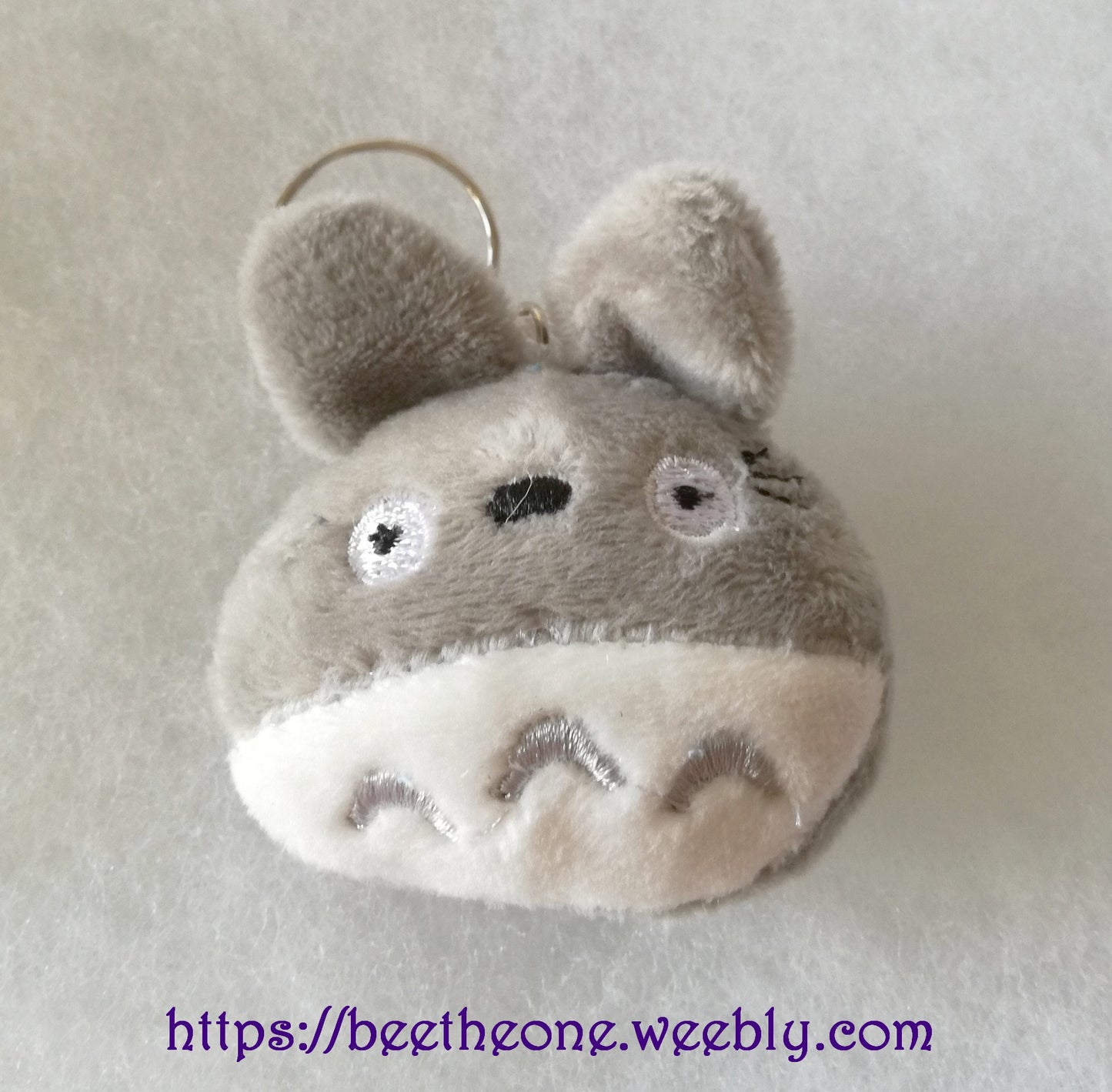 Porte-clé ou Bijou de portable peluche Monstre gris